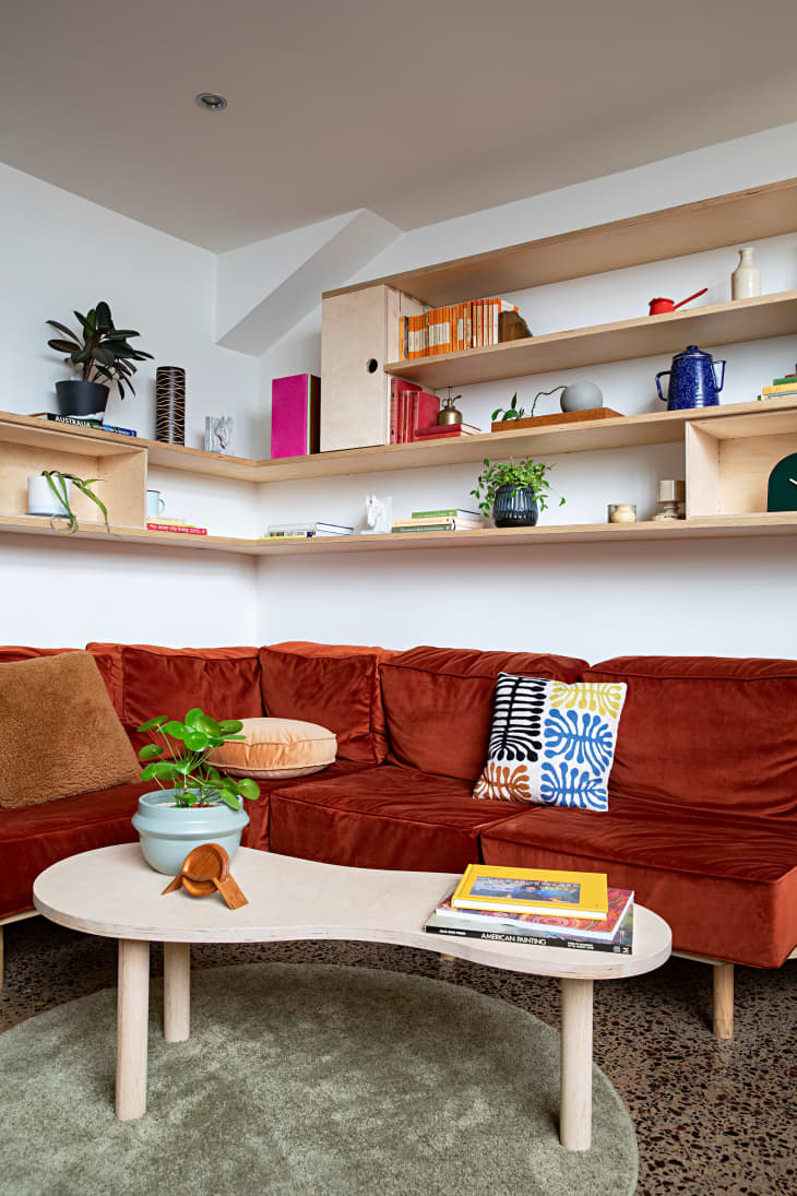 View of See a Renovated Loft with Built-In Storage & Plywood Shelves ...